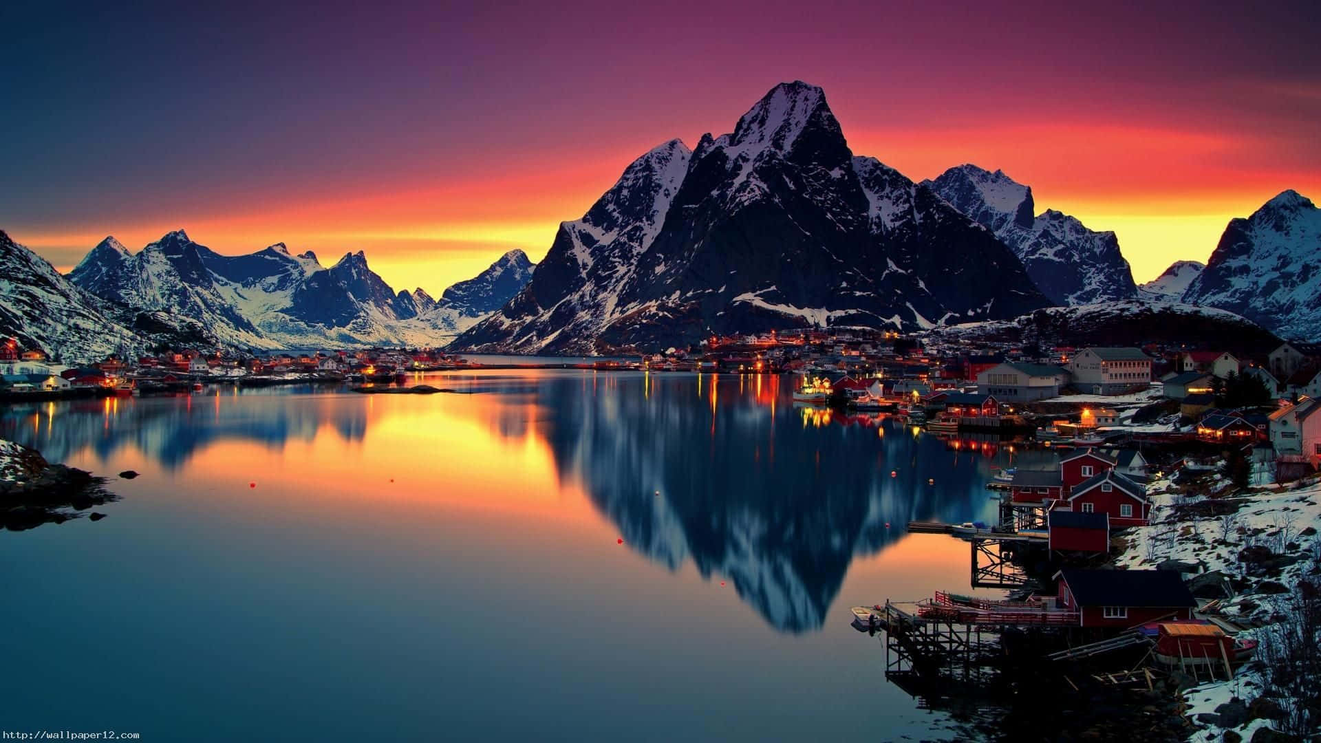 A Beautiful Sunset Over A Lake In A Mountainous Area