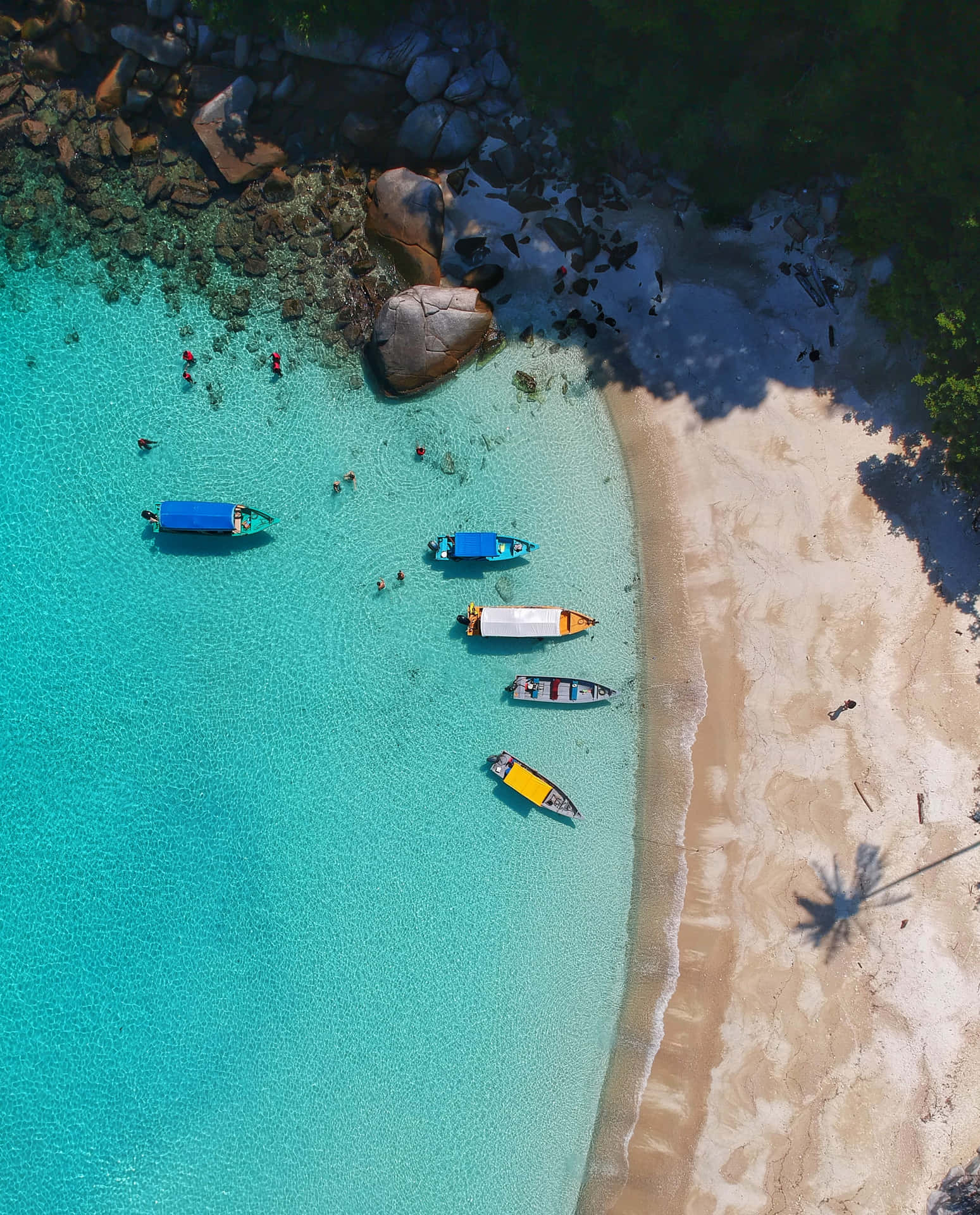 A Beautiful Tropical Beach With Crystal Clear Waters Sparkling In The Sun. Background