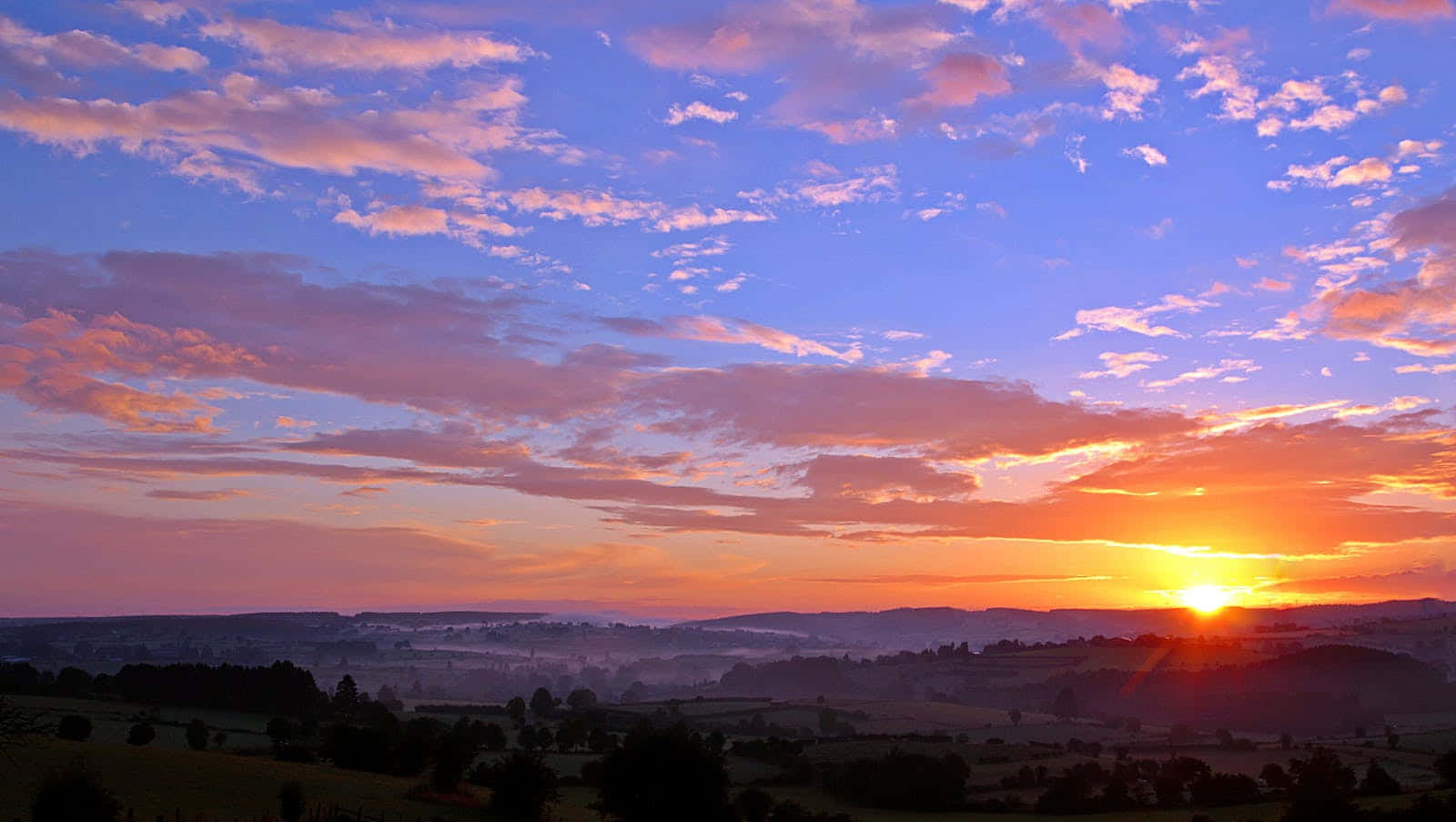 A Beautiful, Vibrant Sunset Filled With Pinks And Oranges