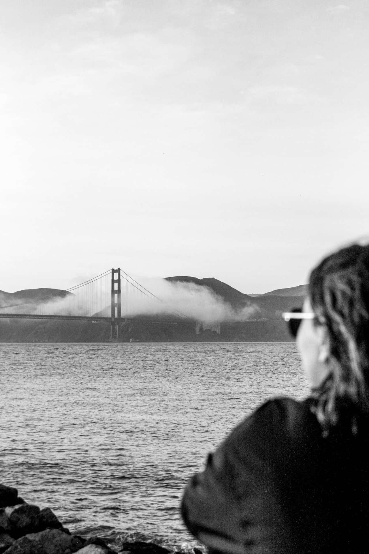 A Beautiful View Of San Francisco, Shrouded In Fog. Background