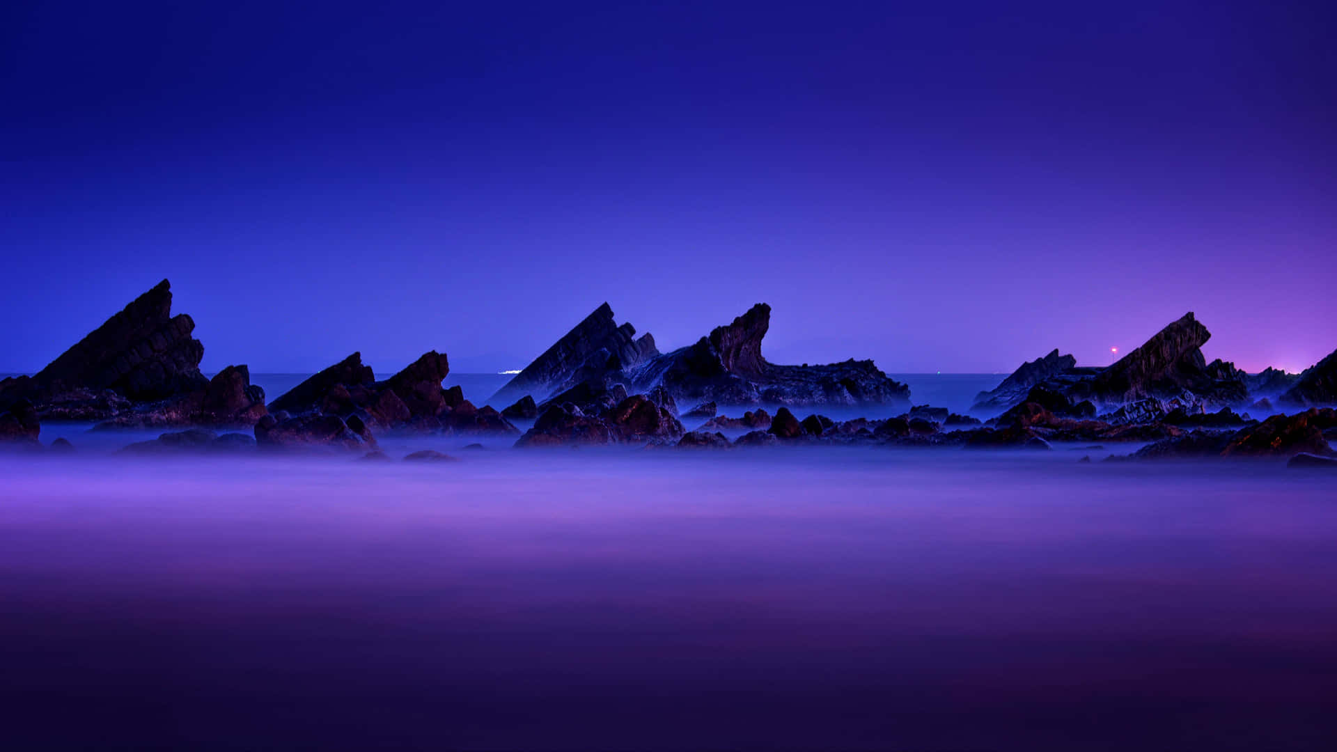 A Beautiful View Of Sun-kissed Hills And A Shimmering Lake. Background