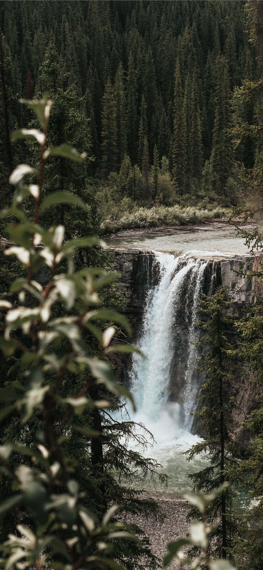 A Beautiful Waterfall View On An Iphone Background