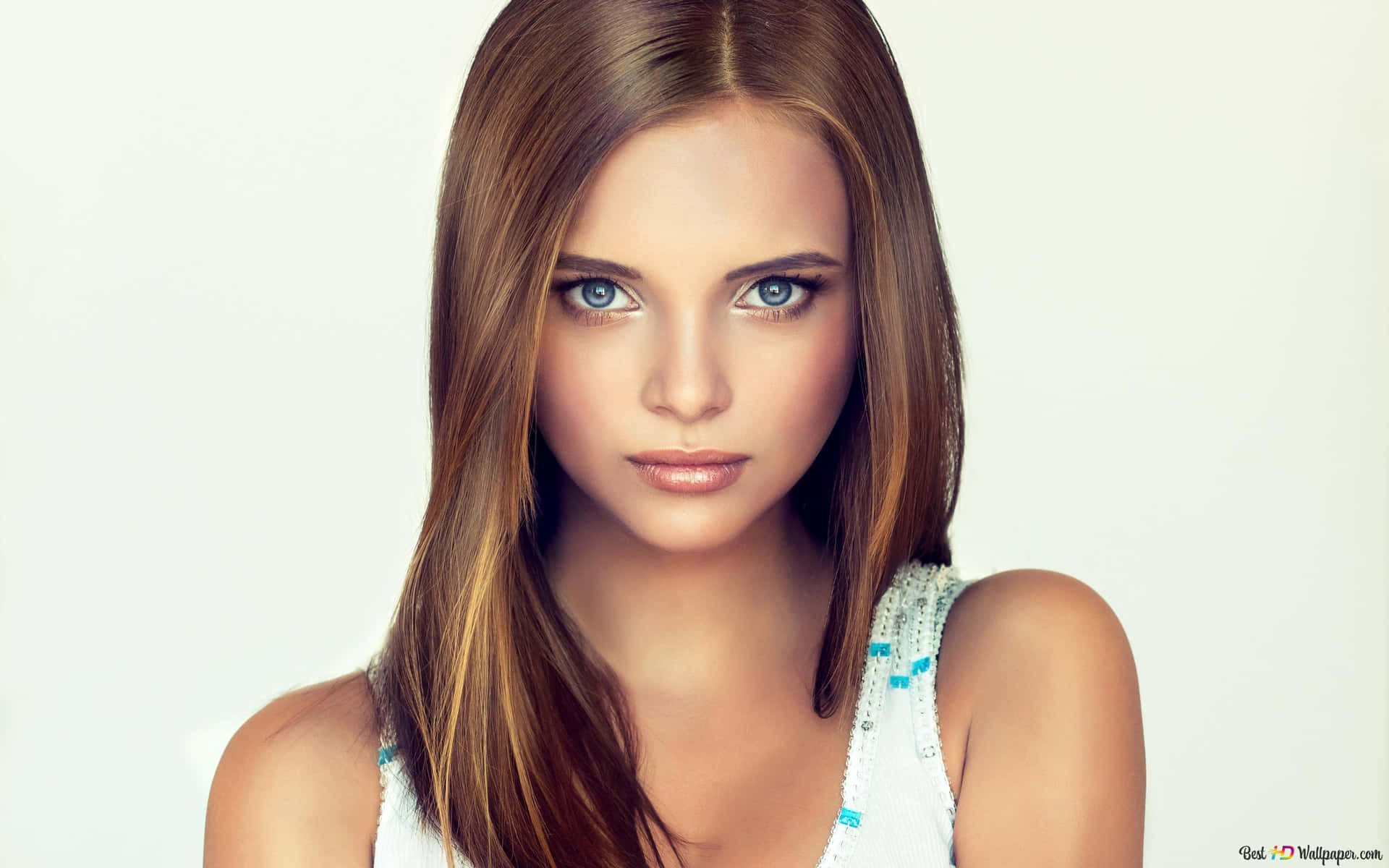 A Beautiful Woman With Brown Hair And Blue Eyes