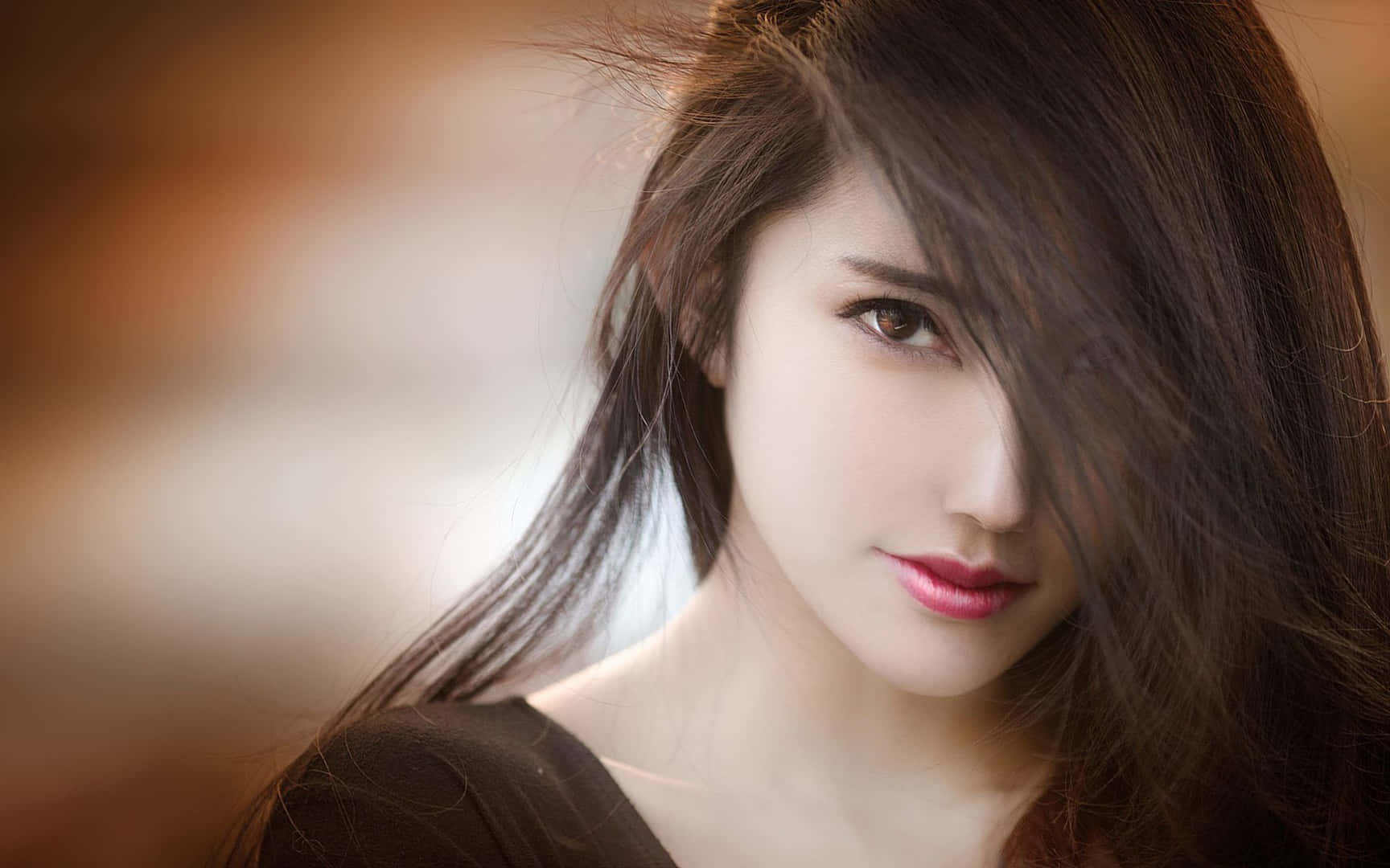 A Beautiful Woman With Long Hair And Pink Lipstick Background