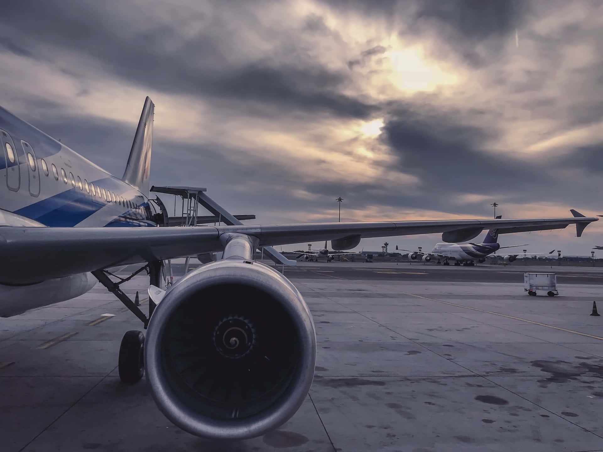 A Beautiful, Young Plane Flying Silently Under The Clouds.