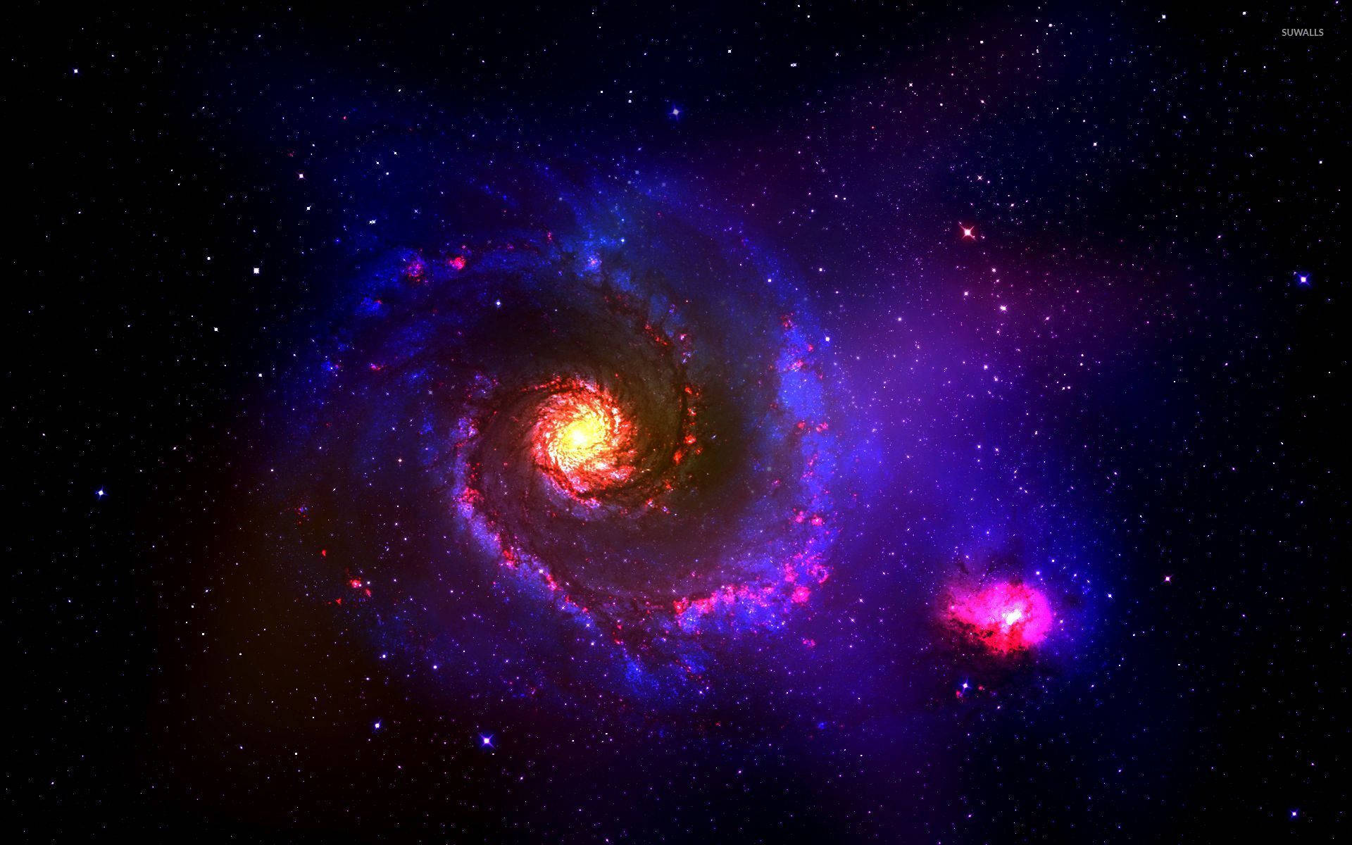 A Big Swirl In The Middle Of A Colorful Galaxy Background