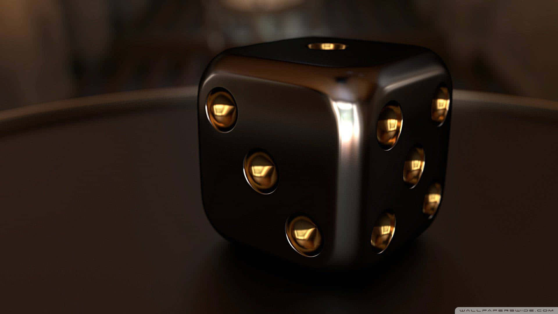 A Black And Gold Dice On A Table Background