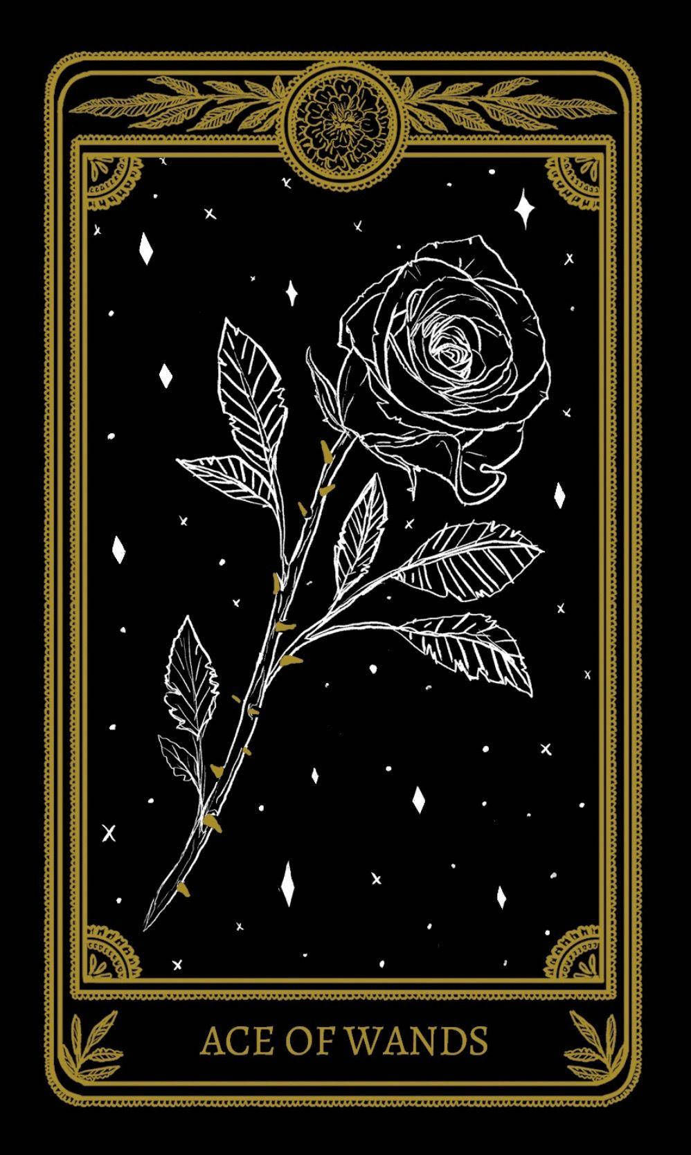 A Black And Gold Tarot Card With A Rose Background