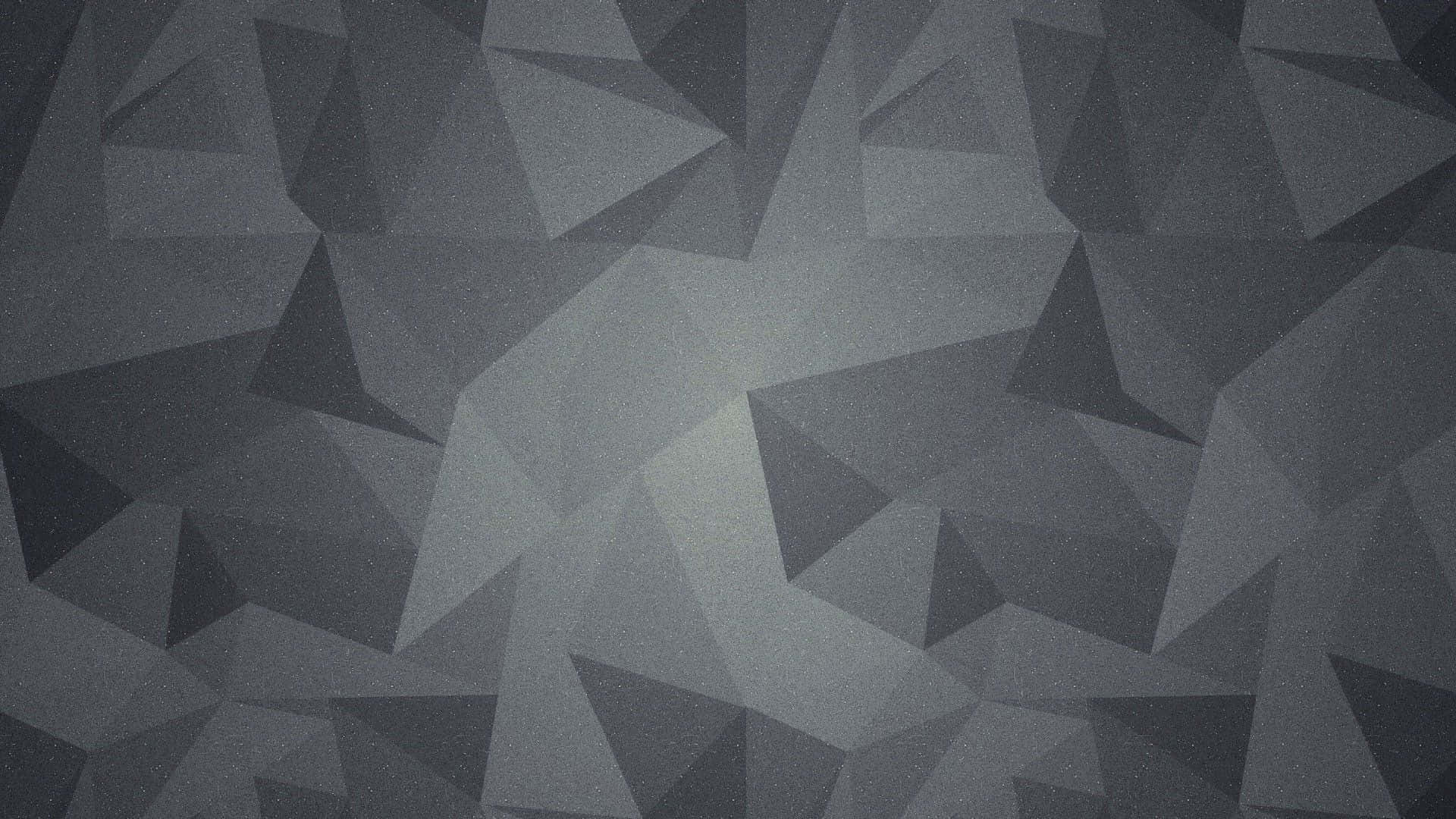 A Black And Gray Wallpaper With Triangles