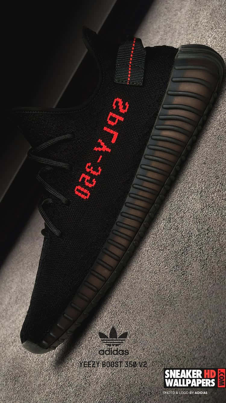 A Black And Red Adi Yeezy Sneaker Background