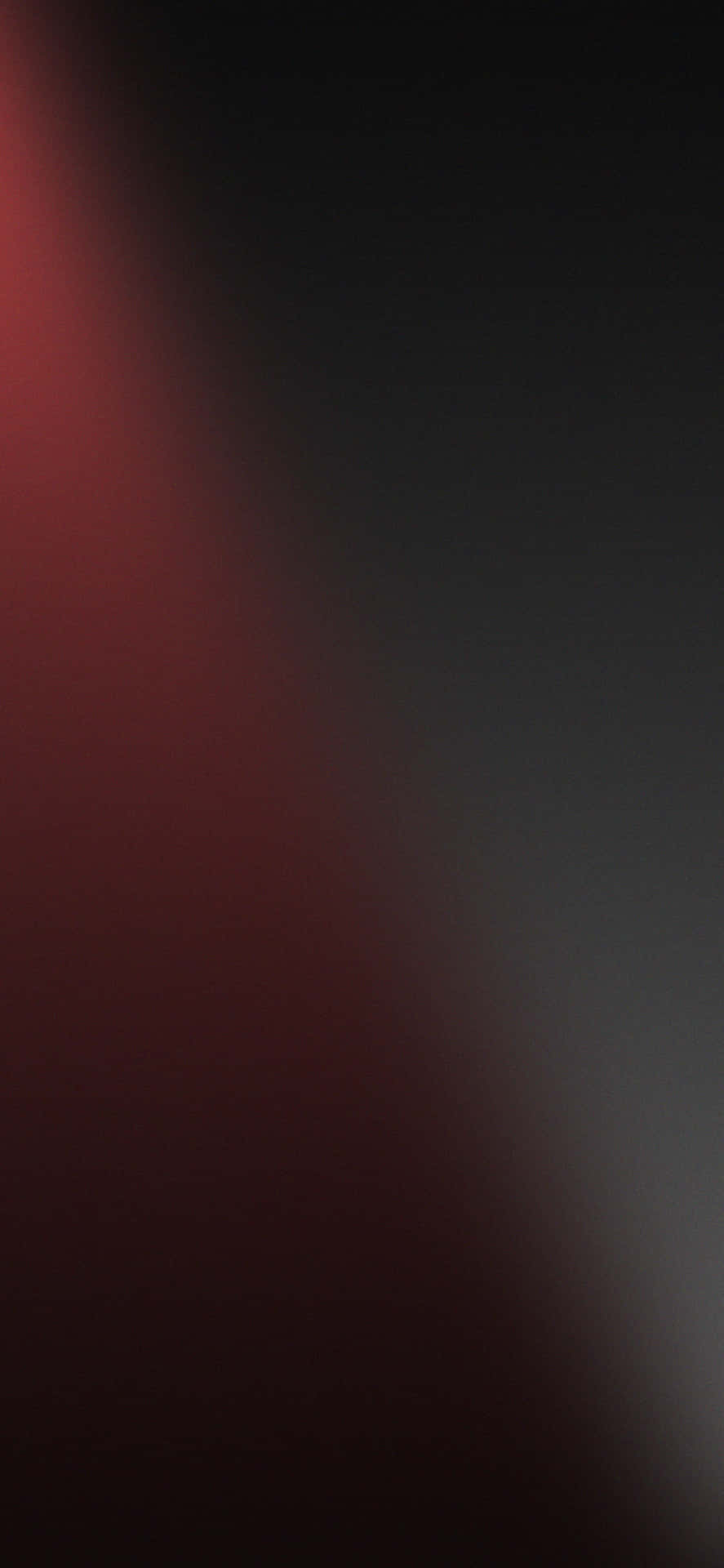 A Black And Red Background With A Light Shining On It Background