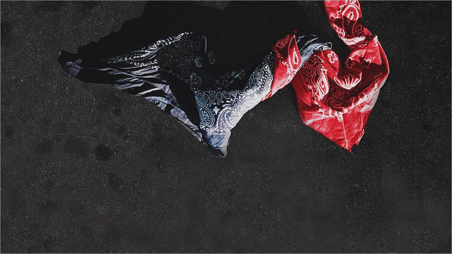 A Black And Red Scarf Is Hanging On The Ground