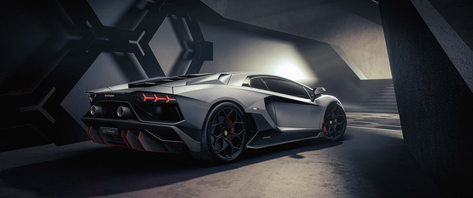 A Black And Silver Sports Car Is Parked In A Dark Tunnel Background