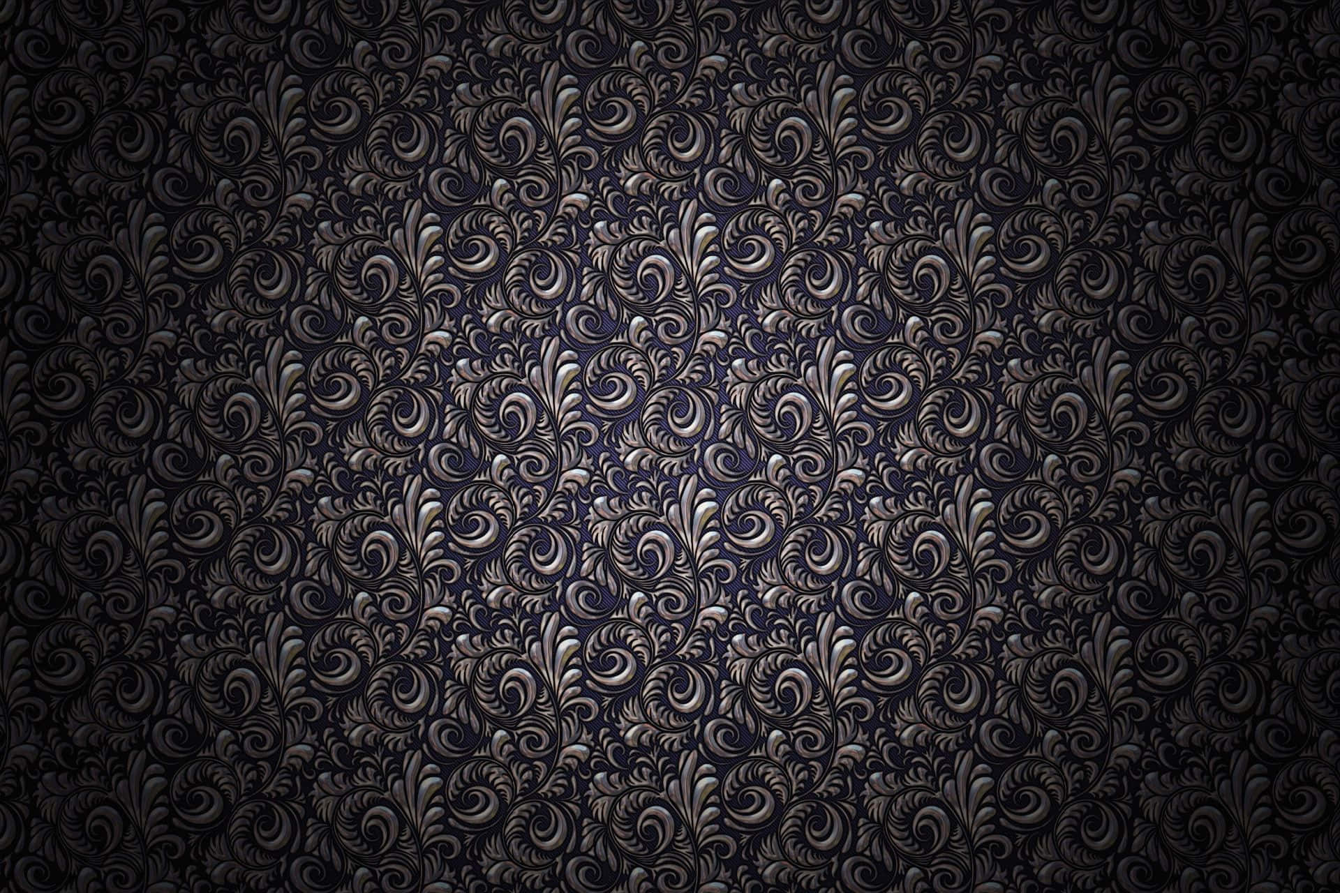 A Black And Silver Wallpaper With Swirls Background