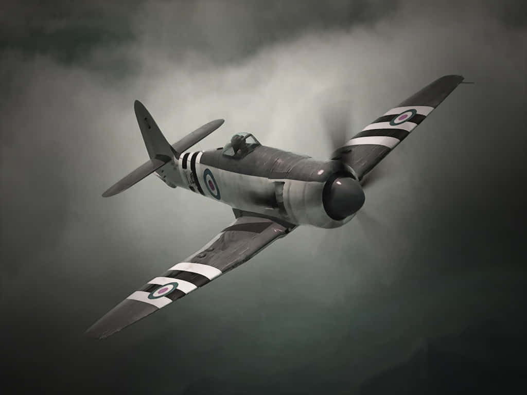 A Black And White Fighter Plane Flying Through The Sky Background