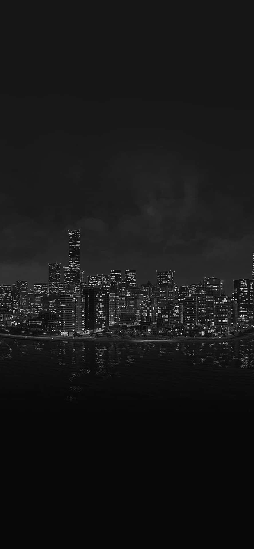 A Black And White Image Of A City Skyline Background