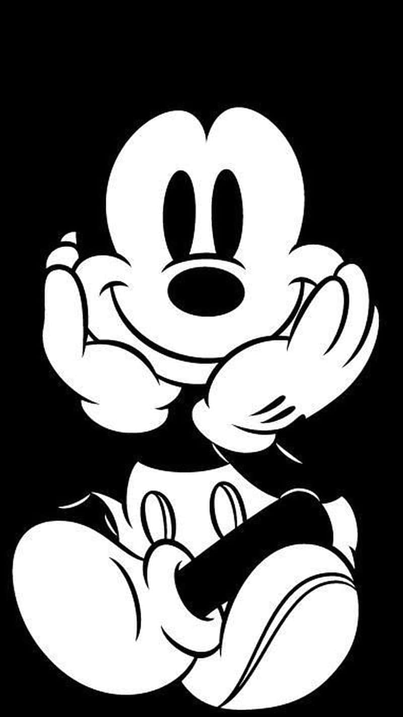 A Black And White Image Of A Mickey Mouse Background