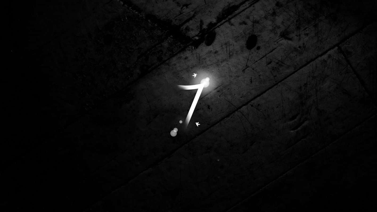 A Black And White Image Of A Number On A Wooden Floor Background