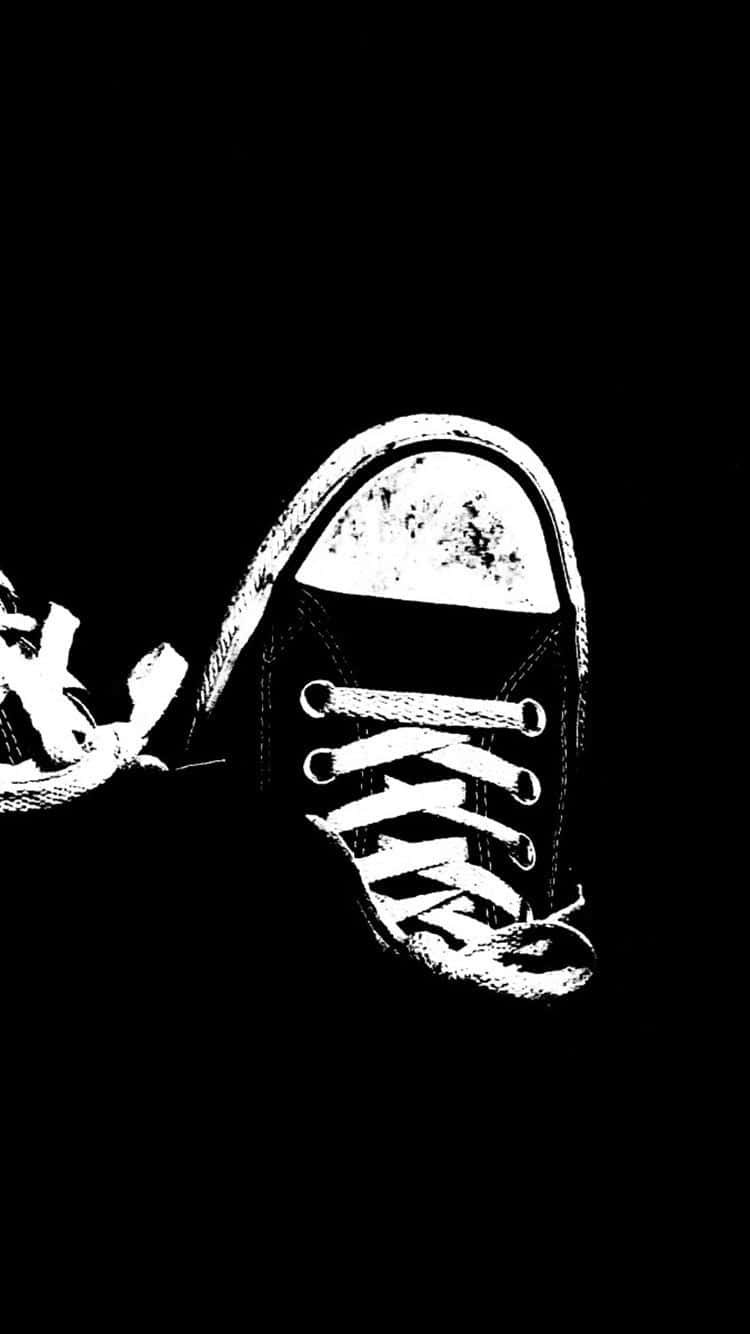 A Black And White Image Of A Pair Of Sneakers Background