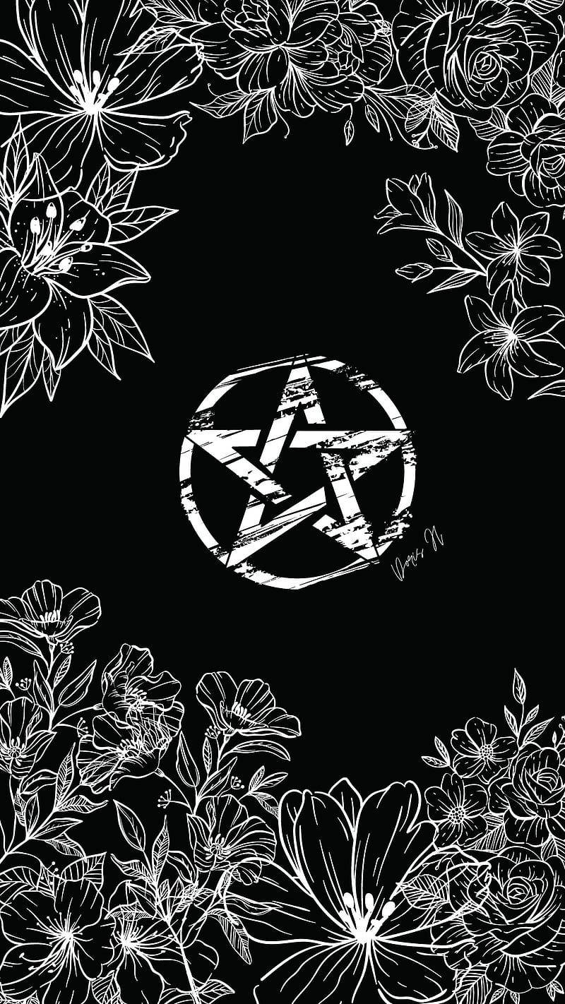 A Black And White Image Of A Pentagram With Flowers