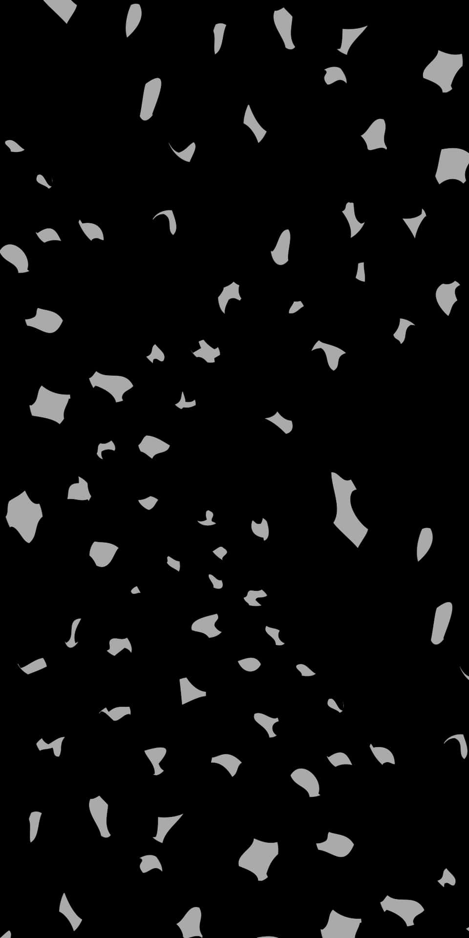 A Black And White Image Of Confetti Falling From The Sky Background