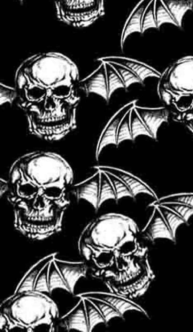 A Black And White Image Of Skulls And Bats Background