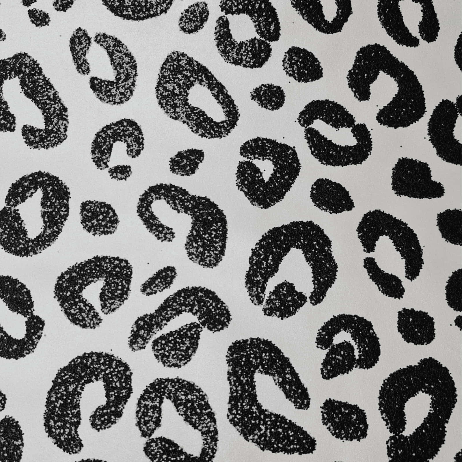 A Black And White Leopard Print Fabric Background