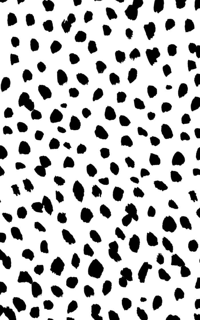 A Black And White Pattern With Spots Background