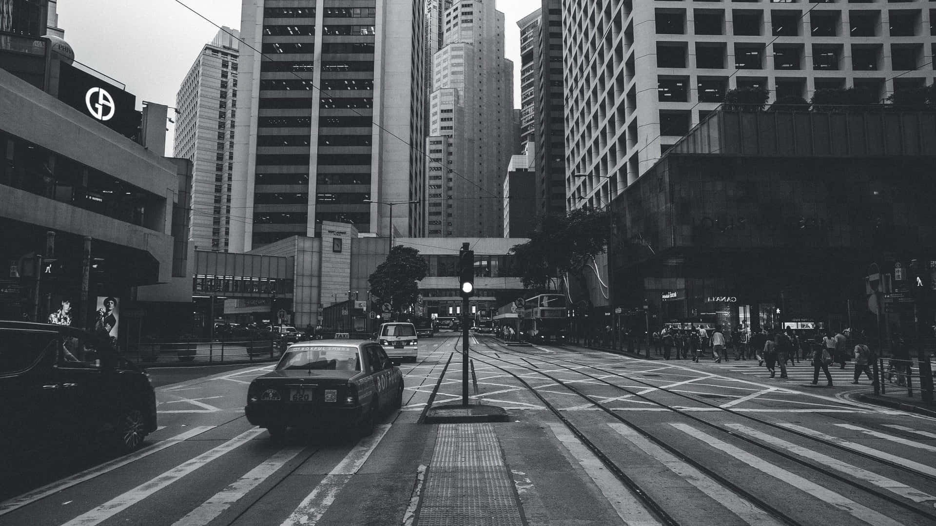 A Black And White Photo Of A City Street