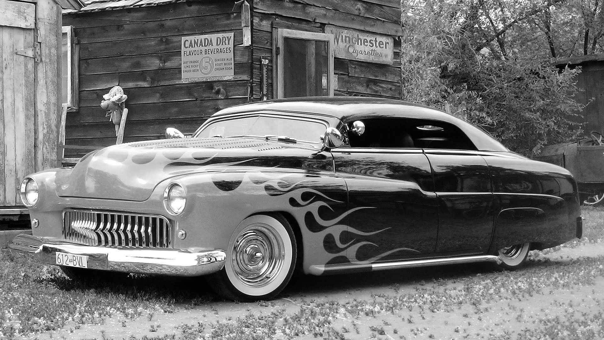 A Black And White Photo Of A Classic Car