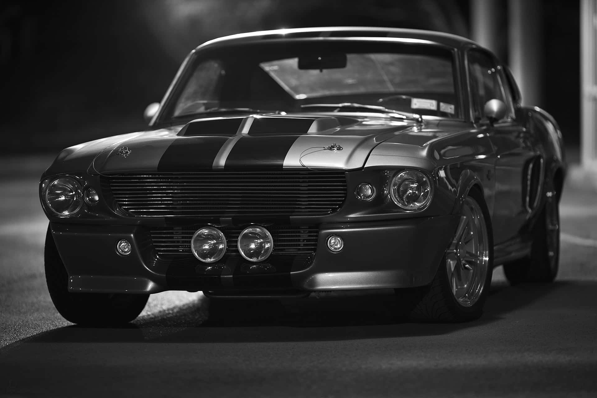 A Black And White Photo Of A Classic Car