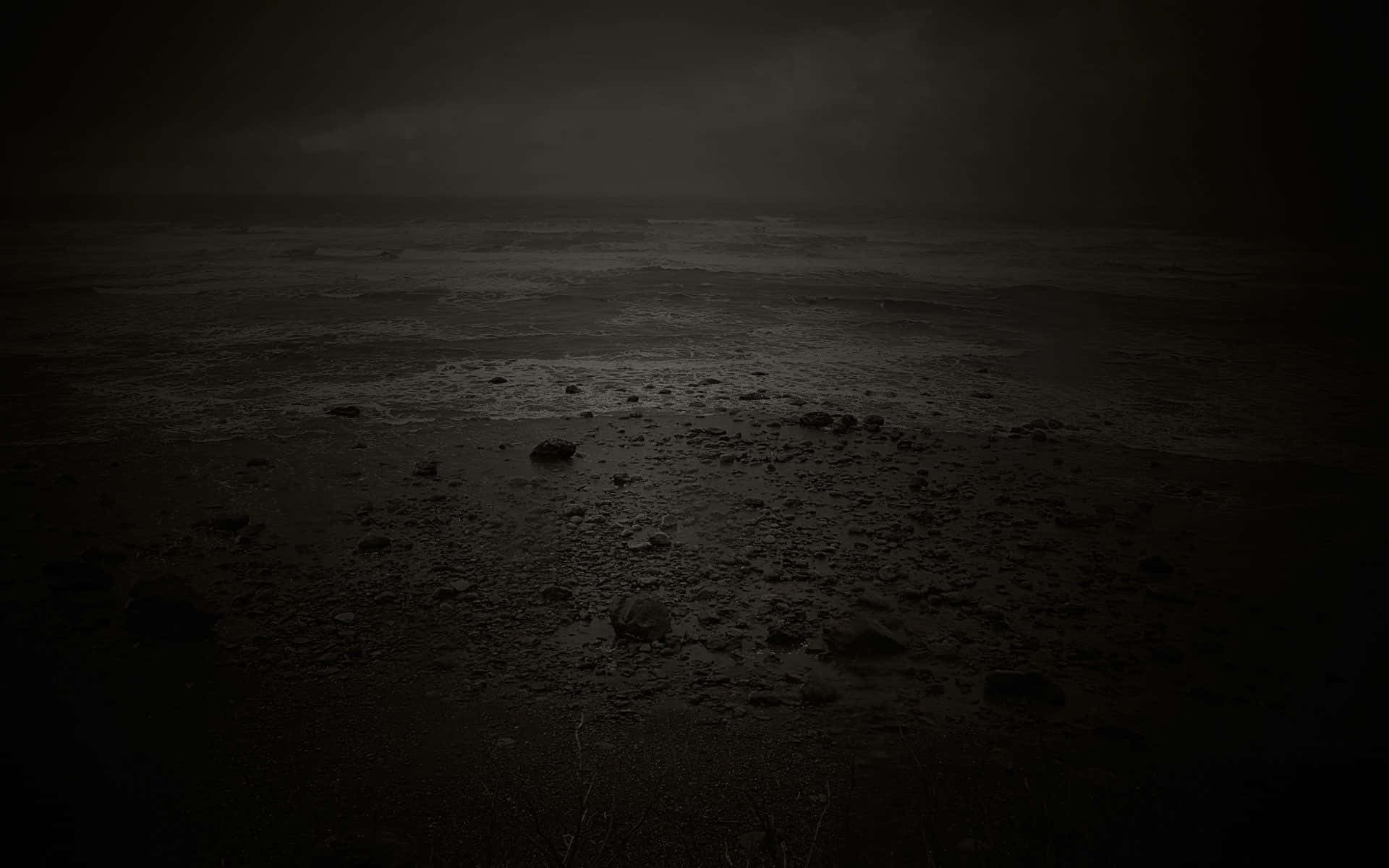 A Black And White Photo Of A Dark Ocean Background