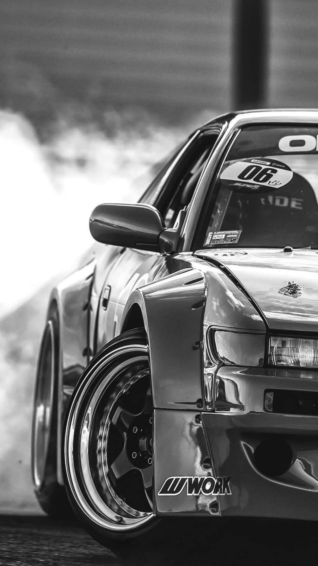 A Black And White Photo Of A Drift Car Background