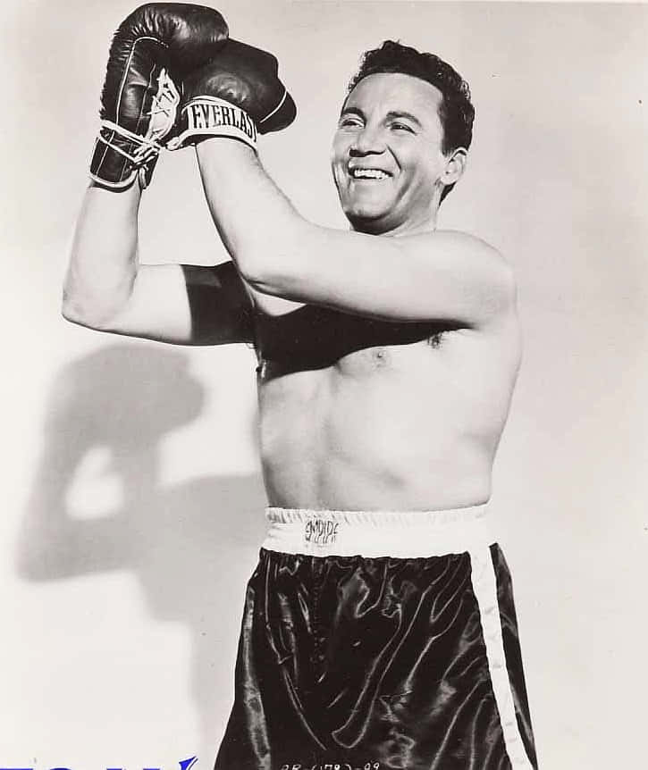A Black And White Photo Of A Man With Boxing Gloves Background