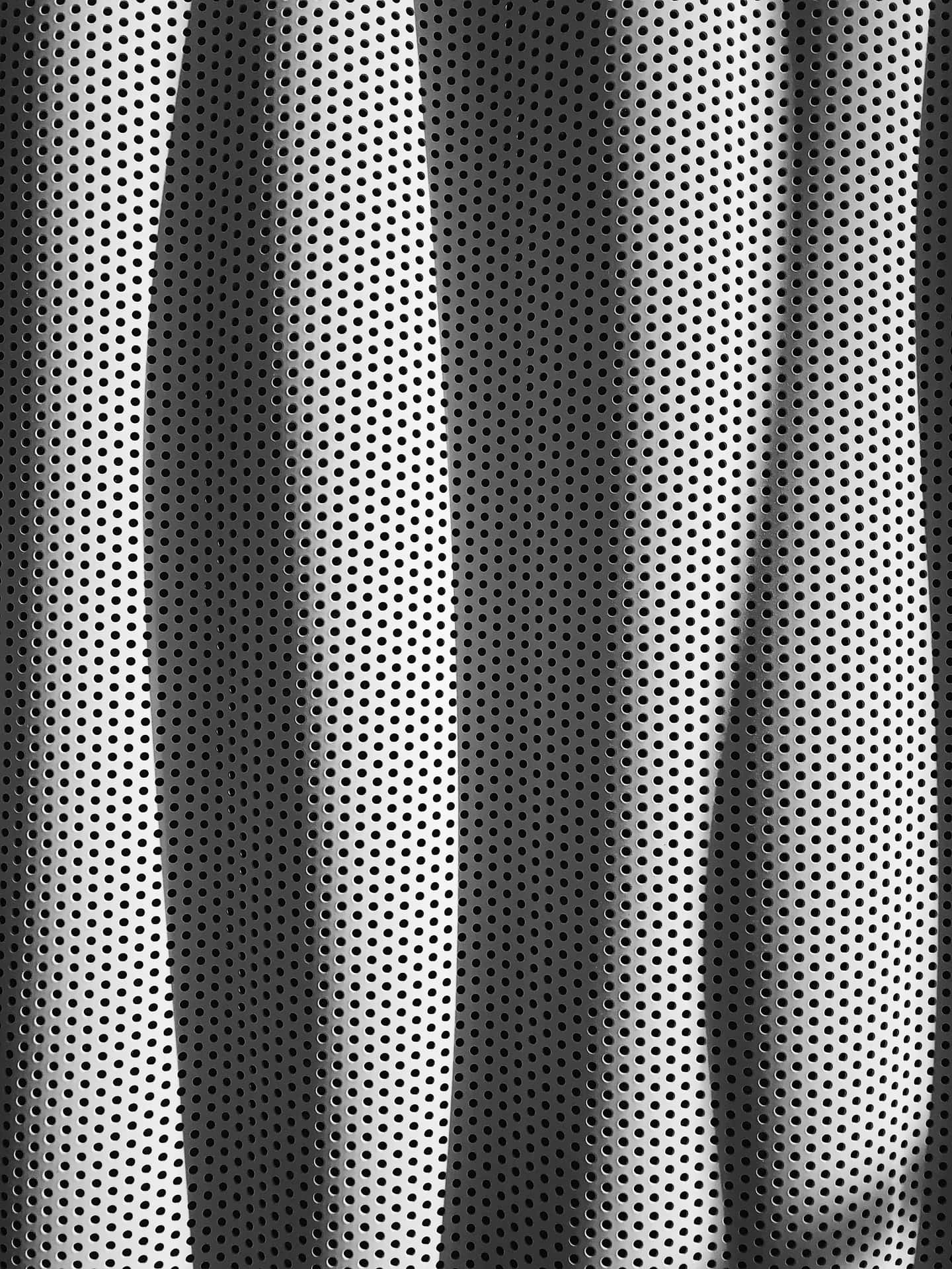 A Black And White Photo Of A Metal Mesh Background