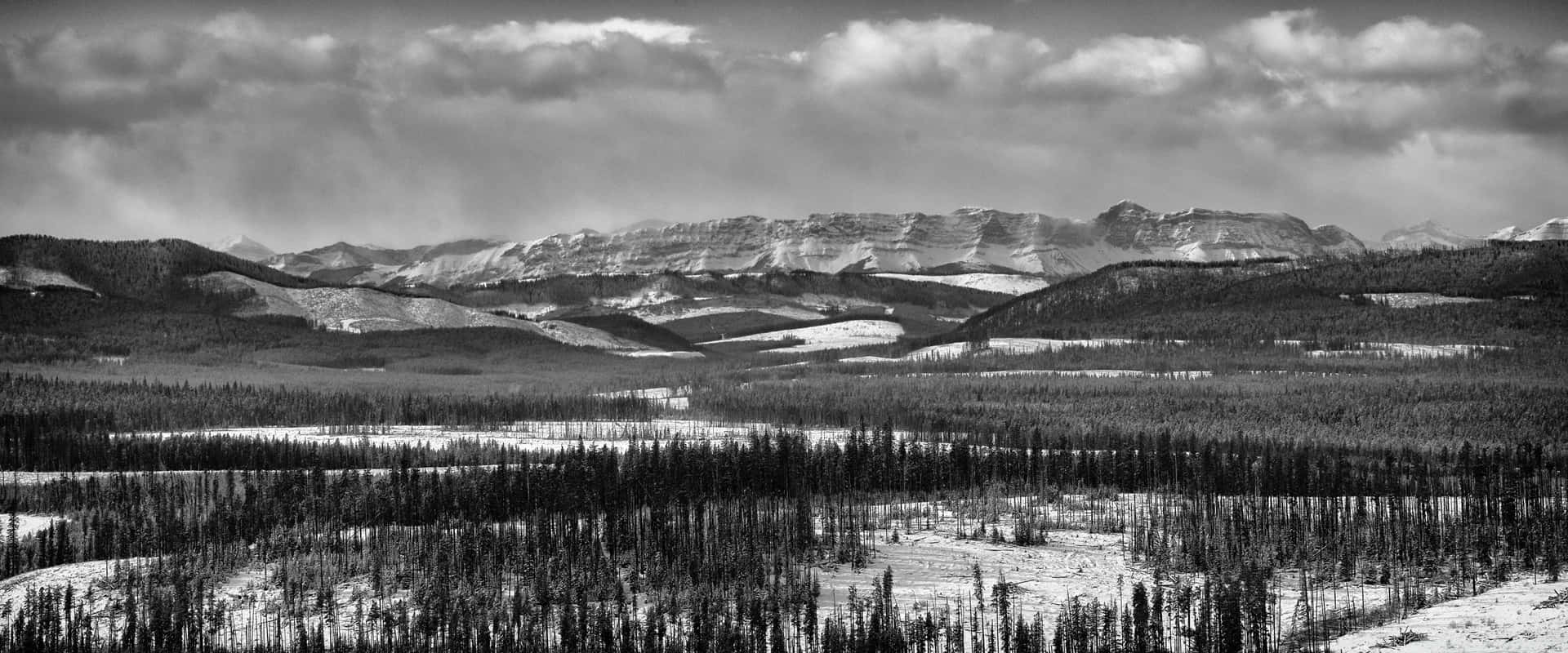 A Black And White Photo Of A Mountain Range Background