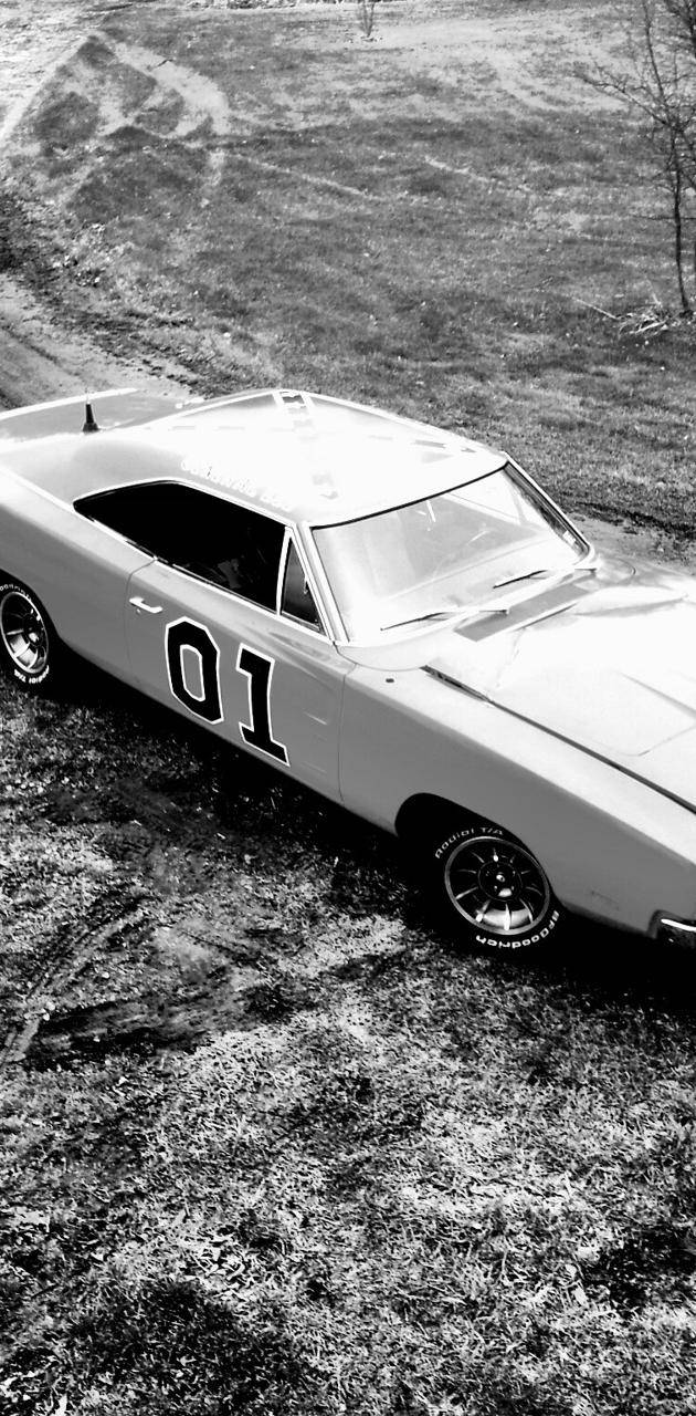 A Black And White Photo Of A Muscle Car