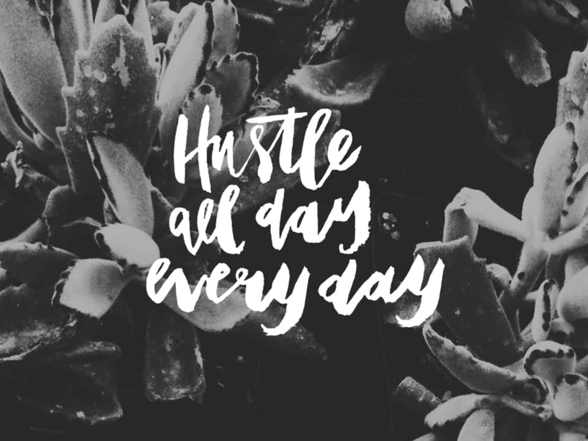 A Black And White Photo Of A Plant With The Words Hustle All Day Every Day Background