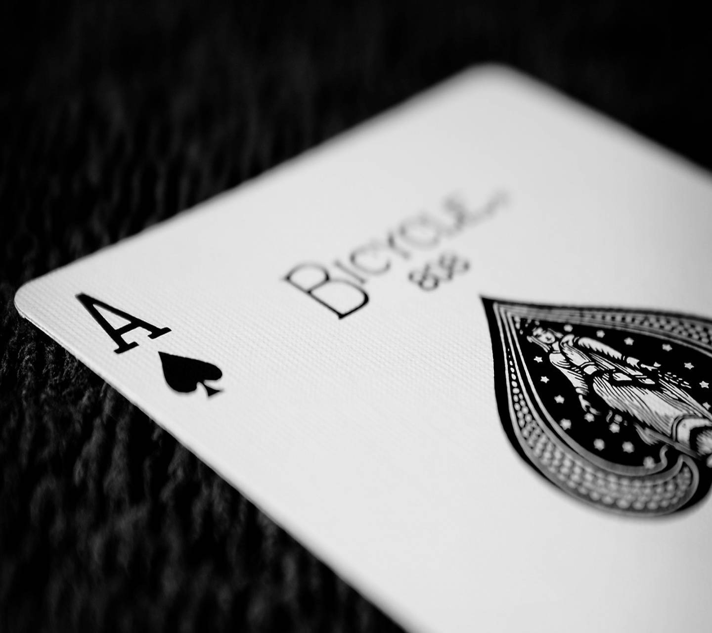 A Black And White Photo Of A Playing Card