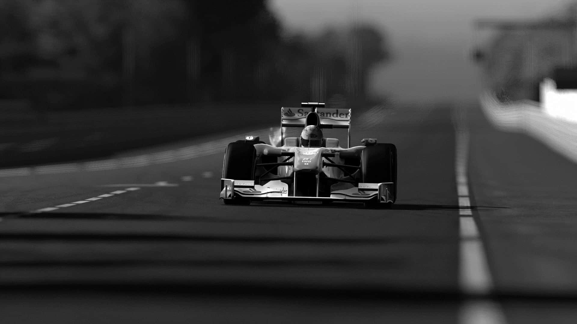 A Black And White Photo Of A Racing Car On A Road Background