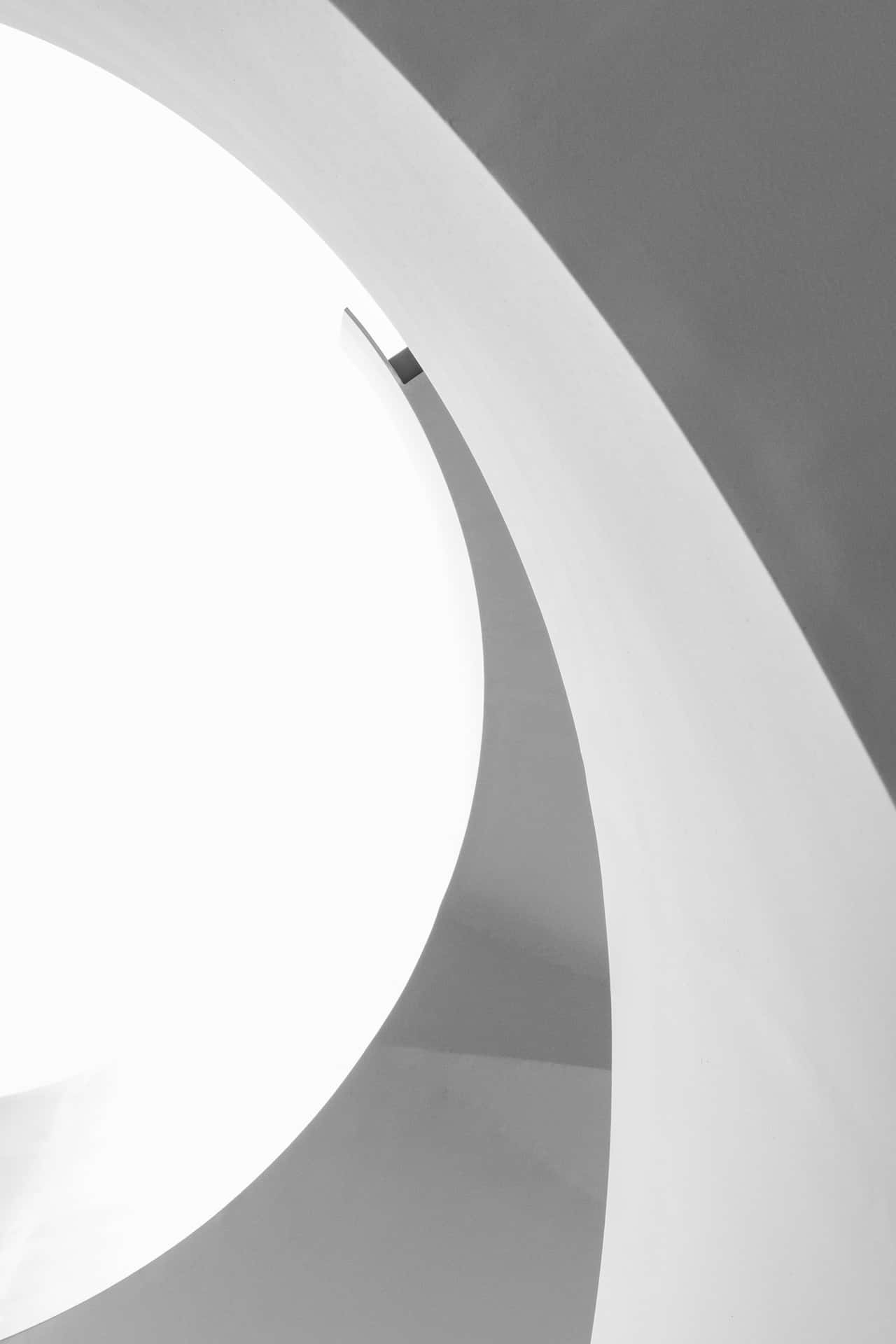 A Black And White Photo Of A Spiral Staircase Background