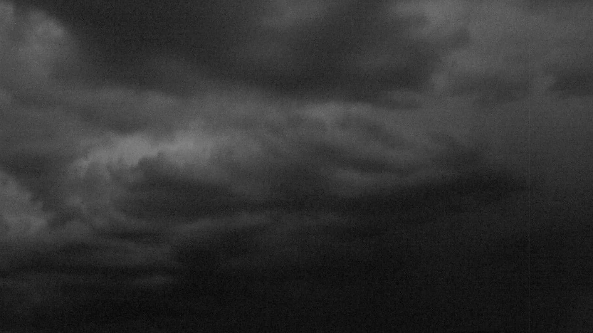 A Black And White Photo Of A Stormy Sky Background