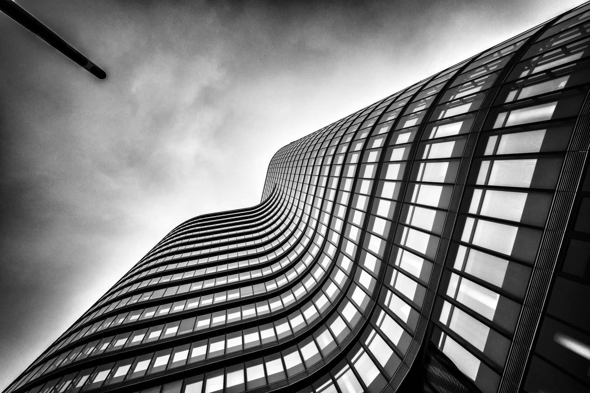 A Black And White Photo Of A Tall Building