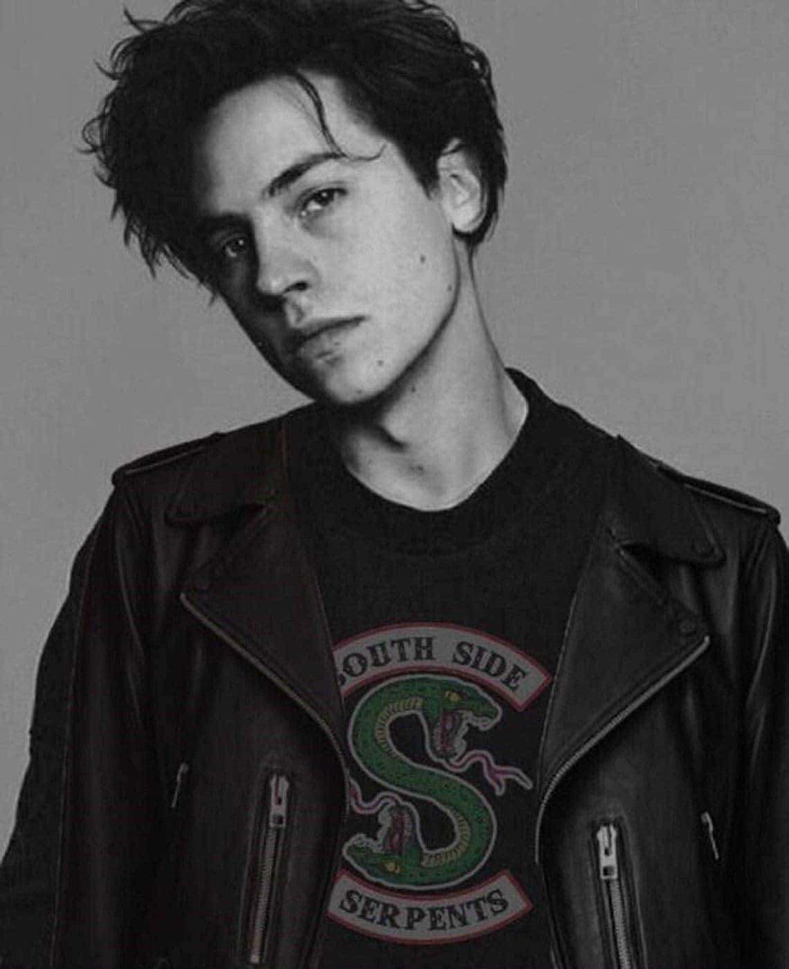 A Black And White Photo Of A Young Man In A Leather Jacket Background