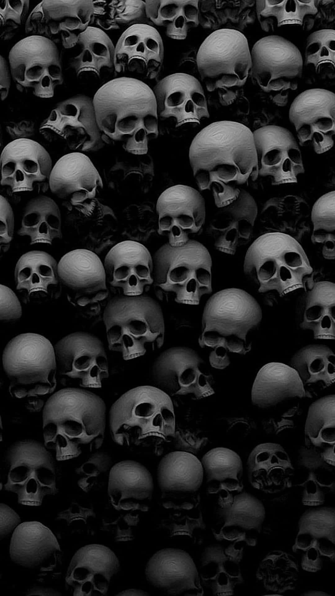 A Black And White Photo Of Many Skulls Background