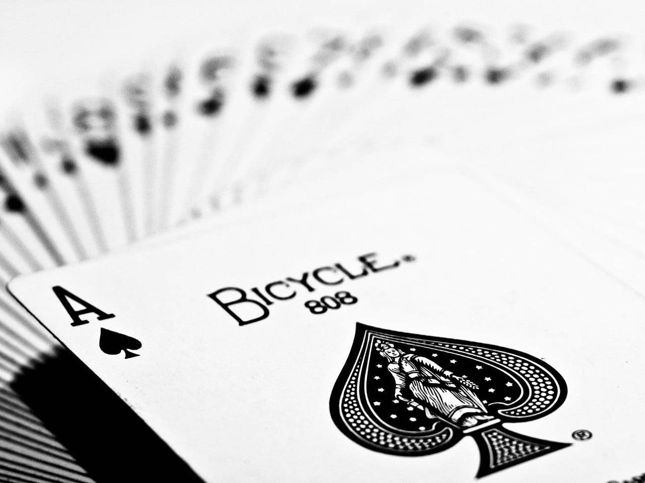 A Black And White Photo Of Playing Cards