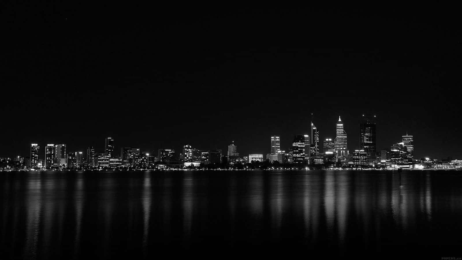 A Black And White Photo Of The City Skyline Background