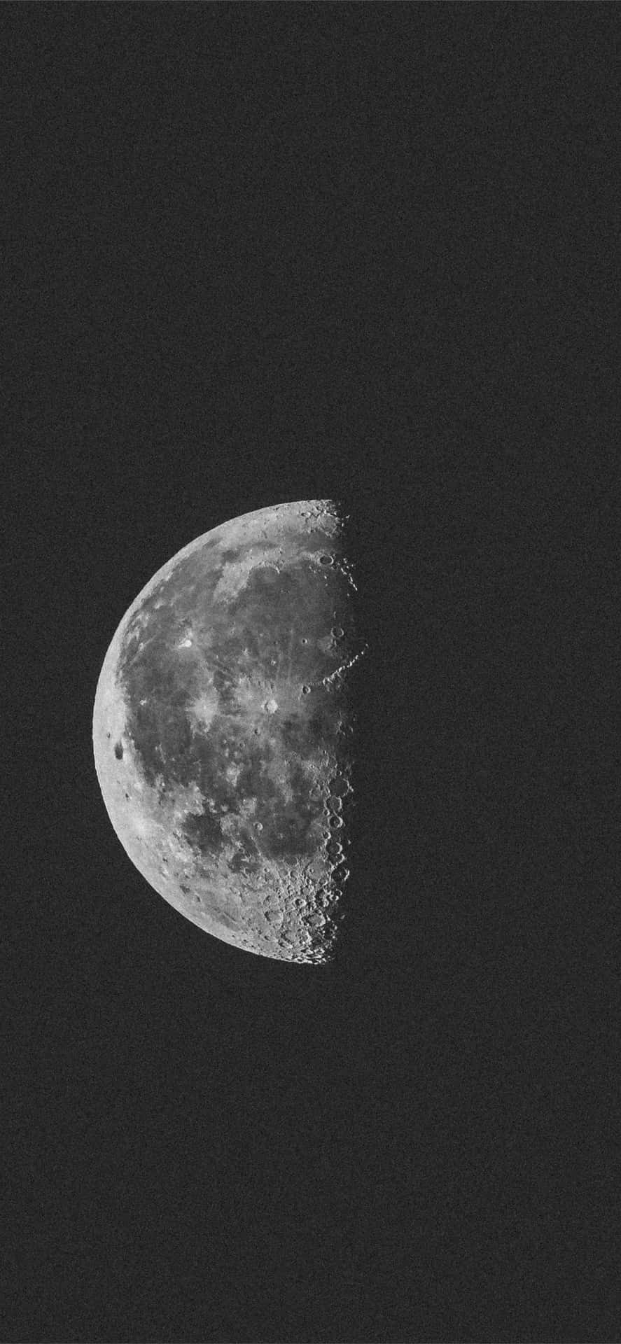 A Black And White Photo Of The Moon Background