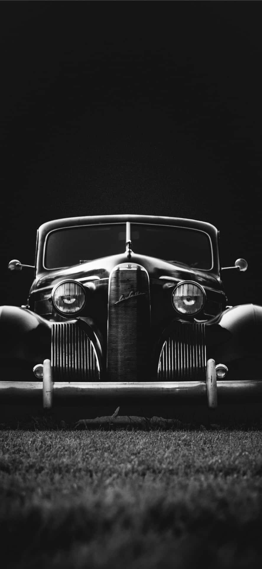 A Black And White Photograph Of An Old Car Background