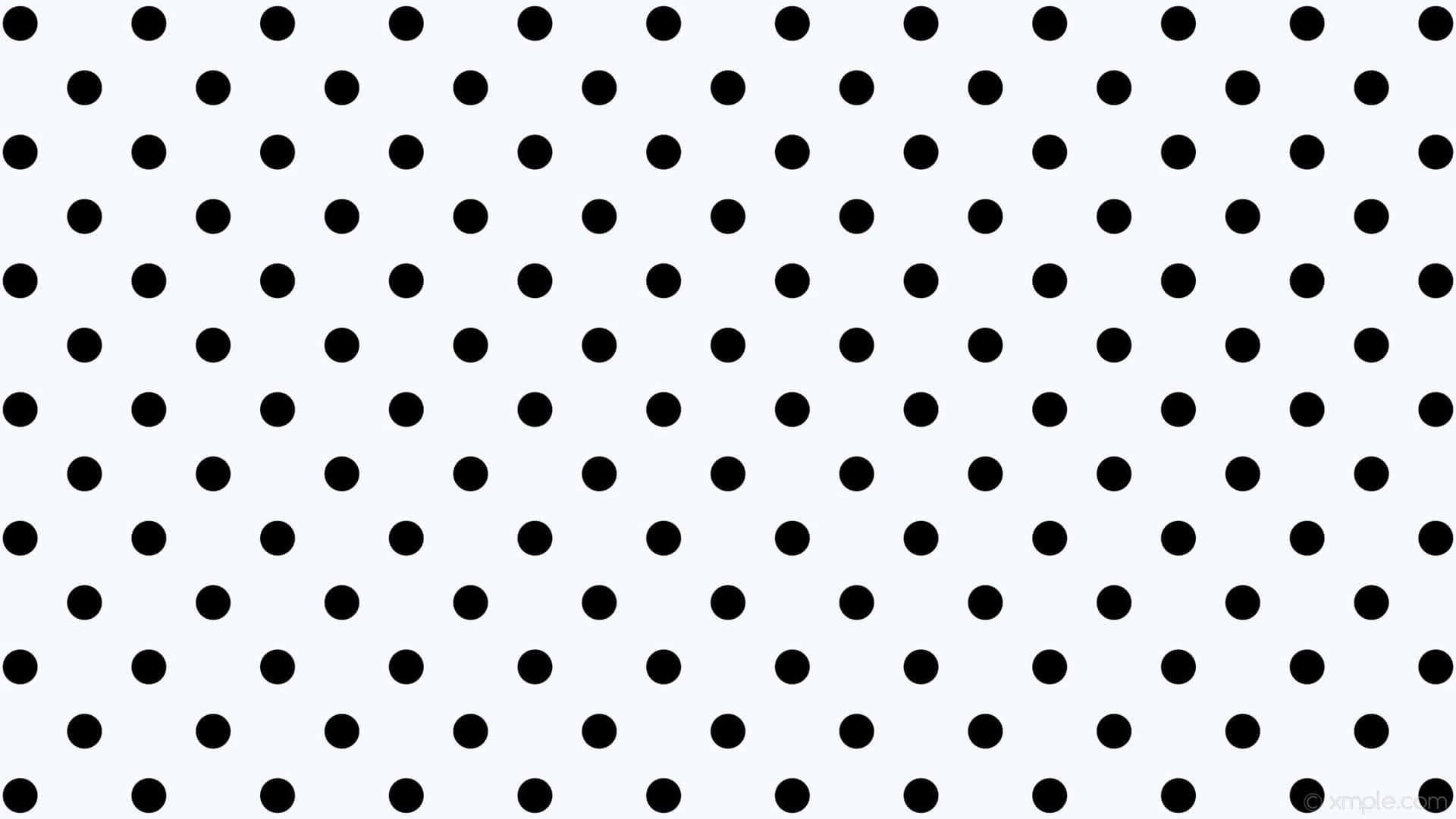 A Black And White Polka Dot Pattern Background